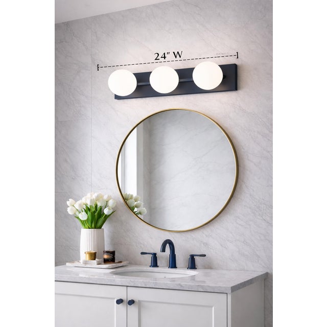 A sleek and architectural “Orbel” 3-light sconce designed by Sean Lavin for Visual Comfort & Co., showcasing a refined...