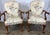 An exceptional, highly detailed pair of mid-20th-century Georgian-style open armchair lounges manufactured by the renowned...