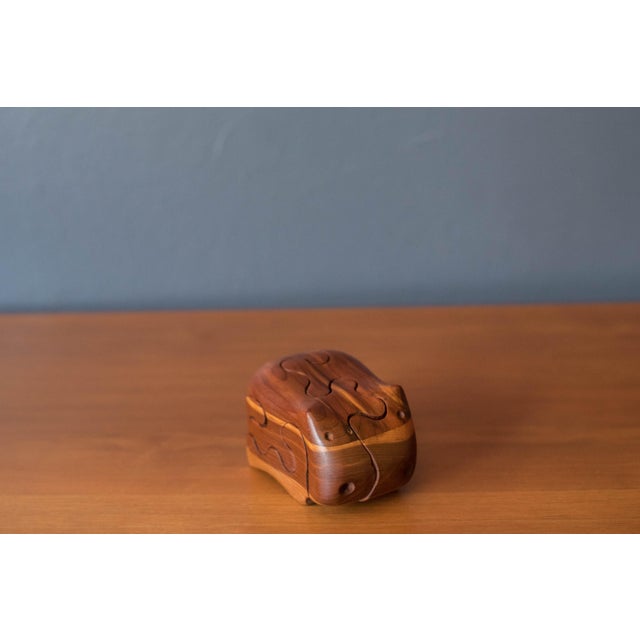 Mid century modern solid wood hippo puzzle box designed by artist Deborah D. Bump, circa 1970s. This sculptural piece...