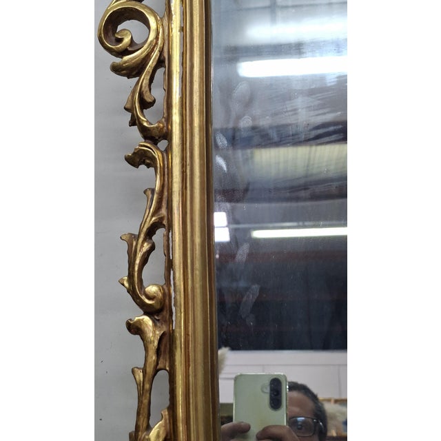 Large Carved and Gilded Wood Mirror – Rococo Style – 20th Century A very important carved and gilded wood mirror,...
