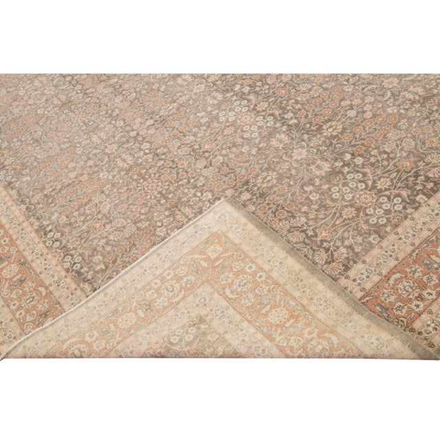 Beautiful antique Sivas hand-knotted wool rug with a brown field. This Sivas piece has a rusted frame and beige accents in...