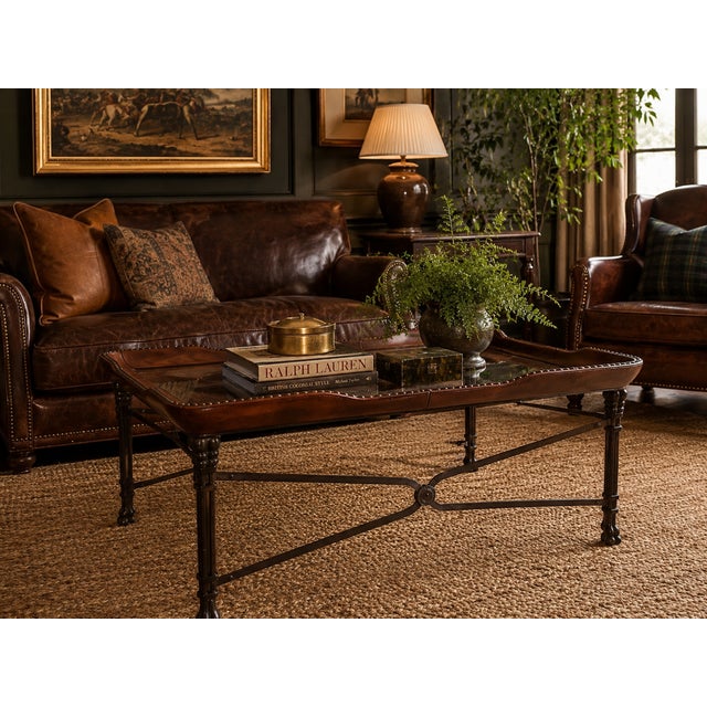 Elegant large-scale coffee table attributed to Maitland-Smith, featuring a richly toned leather-wrapped gallery edge...