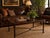 Elegant large-scale coffee table attributed to Maitland-Smith, featuring a richly toned leather-wrapped gallery edge...