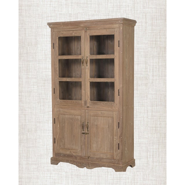 Warm wood. Clear glass. A cornice that carries quiet authority. This antique Indian Armoire has the proportions of...