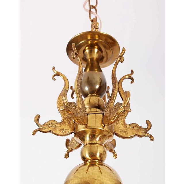 High-quality six-arm chandelier made of polished brass. The chandelier is decorated with fish motifs. Fully functional....