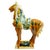 A grand, sculptural Tang Dynasty-style ceramic horse standing an impressive 23 inches tall. This large-scale piece is a...