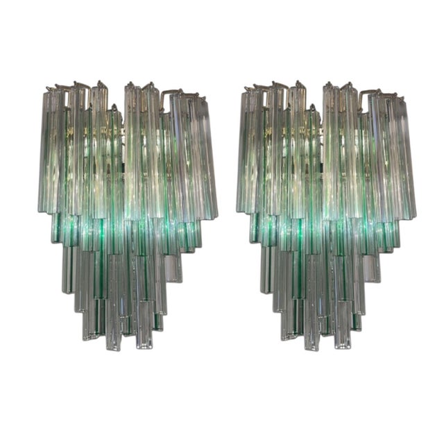 Striking Set of Four Mid-Century 1960's Italian Murano glass wall sconces composed of clear crystal triangular prism glass...