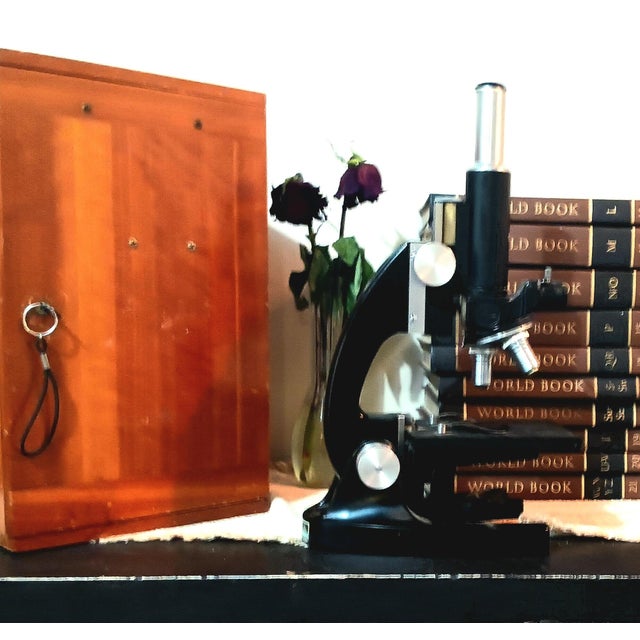 A beautifully preserved vintage Bausch & Lomb monocular microscope presented in its original fitted hardwood locking case...