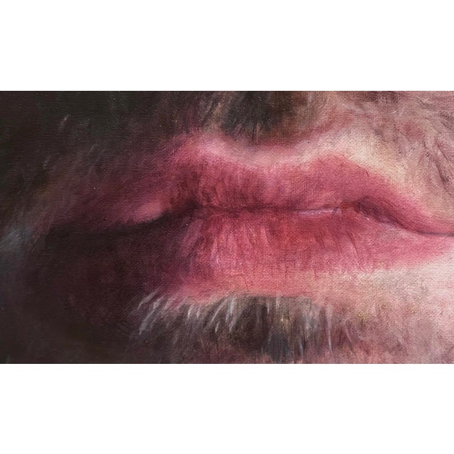 The artwork presents a striking portrait of a man, emphasizing his intense blue eyes that draw the viewer in. The use of...
