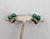 1960s goldtone leaves with two cabochon faux-jade clip earrings. Marked "PANETTA" on the clips. Measure: 3/4 inches long...