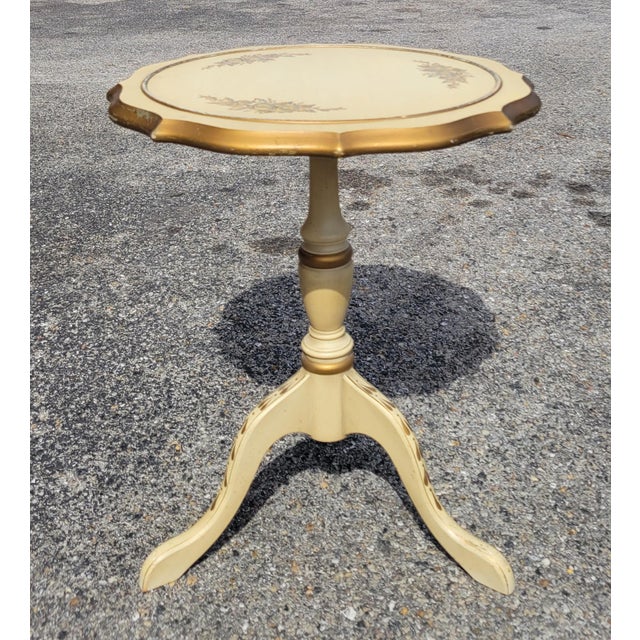 This mid-century conversation set includes two tufted chairs and a painted round table. The chair frames and table are...