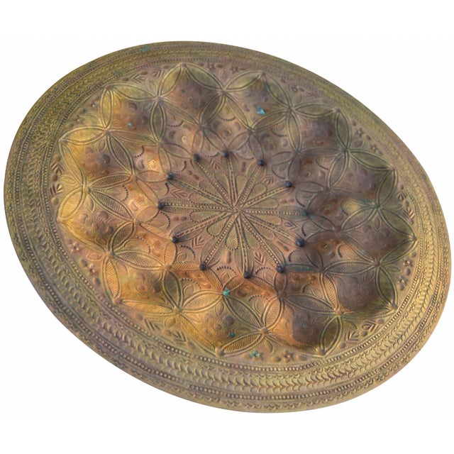 Brass tray hand-hammered in Fez, Morocco with ornate Moorish design and intricate engraved details. This gorgeous accent...