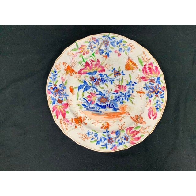Gorgeous antique hand painted plate. Floral design that includes butterflies and an assortment of flowers. Colorful and...