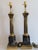 A pair of brass & marble French Empire style table lamps. Fluted brass corinthian columns topped with cast scrolled...