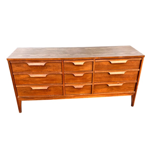 Johnson Carper “Fashion Trend” Mid-Century Walnut Triple Dresser Striking mid-century modern triple dresser attributed to...
