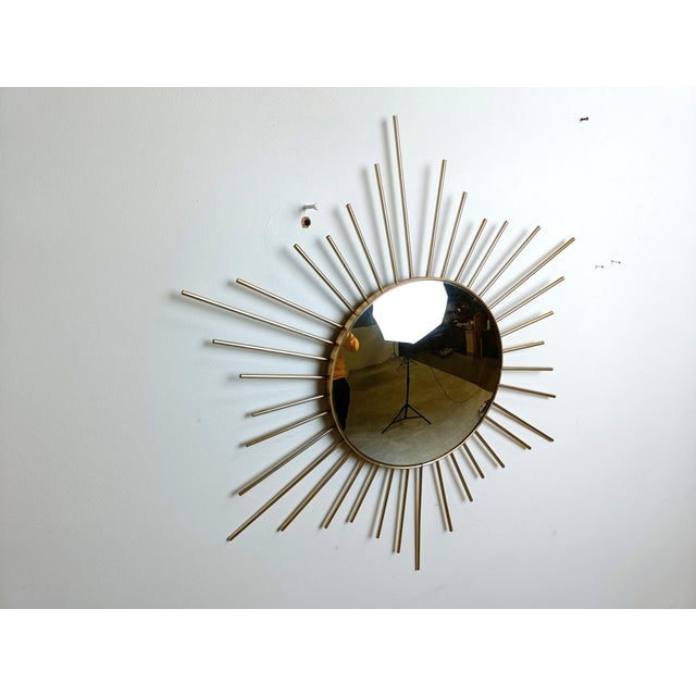 Mid century brass sunburst or flower mirror with convex glass. This mirror fits in most interiors and is a perfect add-on...
