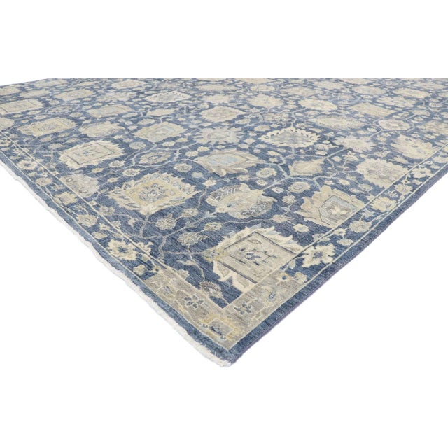 Distressed Oushak style rug with modern design. Blending elements from the modern world with a tranquil color palette,...