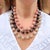 This outstanding glass bead dates from the 1950s and was made in France. Elements of its design have a strong resemblance...