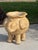 A wonderfully sculptural elephant planter featuring a rounded body, expressive curved trunk, oversized ears, and four...