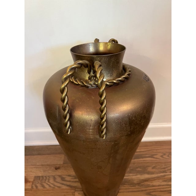 Large urn with beautiful rope handle detail.