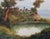A romantic landscape with a small lake or pond in the foreground reflecting the surrounding vegetation, lush trees, and...