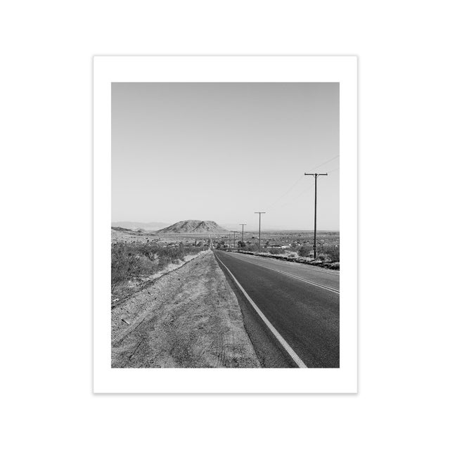 Photographic print of the open road Out West by Niqui Carter. Open edition digital C-print on archival photo paper which...