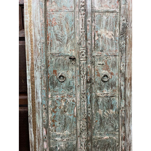 Bring centuries of craftsmanship into your home with this stunning pair of antique Indian double doors. Hand-built from...