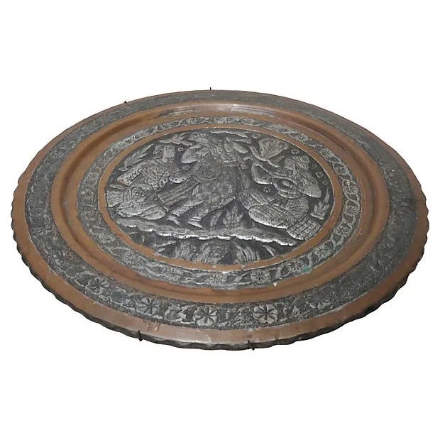 Antique, hand-chased and engraved Middle Eastern silver copper tray, with raised silver overlay depicting a musician and...