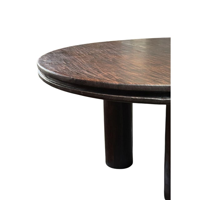 This round dining table is crafted from reclaimed teak, celebrating the natural beauty and quiet strength of aged wood....