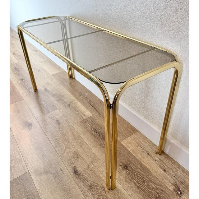 Hollywood Regency Brass Console Table With Smoked Glass Top and Waterfall Edges For Sale - Image 4 of 9