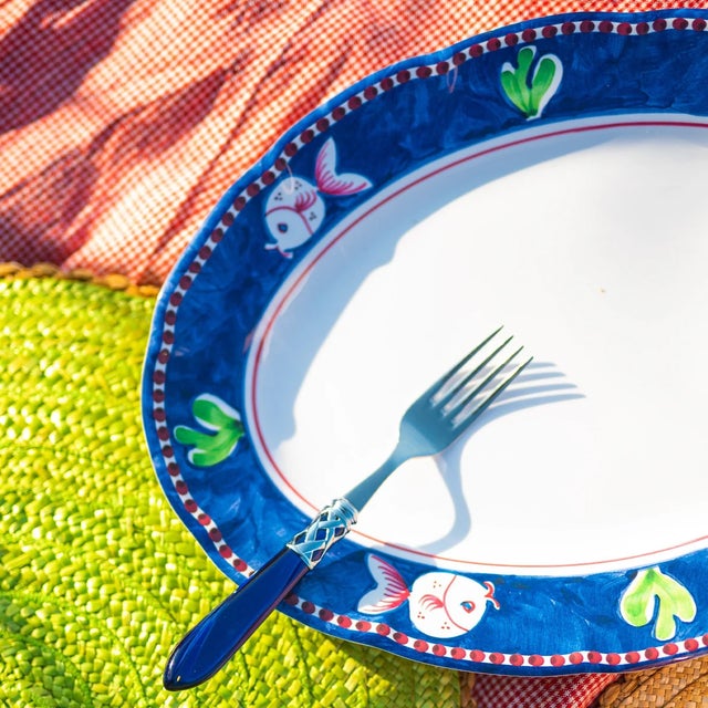 The Melamine Campagna Pesce Oval Platter features happy-looking hand painted fish swimming in a deep blue sea, and its...