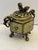 100 years old Chinese tripod incense burner or censer. It features gild-bronze body decorated with colorful enamel in a...