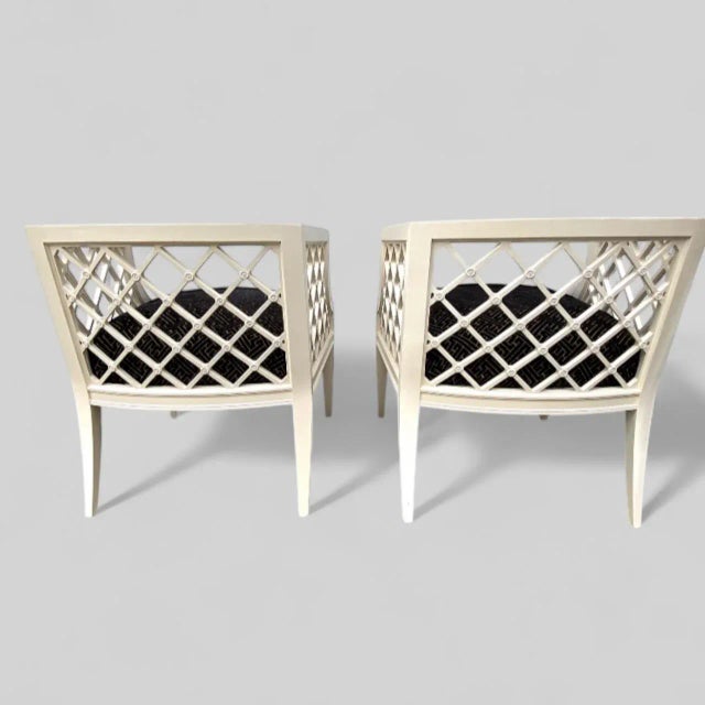 A lovely pair of 1940s Grosfeld House Vintage White painted Lattice-Work Lounge Chairs. Both chairs are in very good...
