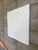 Textured relief with abstract botanical and organic forms. The raised surface creates gentle shadows and dimension, giving...