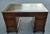 A handsome English Georgian mahogany partners’ desk, dating to the early 19th century, with a richly figured mahogany...