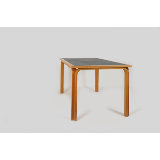 Danish table, designed by Thygesen and Sorensen for Magnus Olesen, 1970s. Model DK 7870, rectangular, with curved solid...