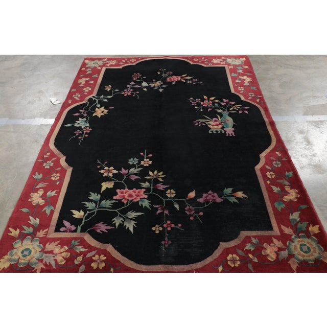 Hand-knotted in wool and originating in China, this 6x9 vintage rug is an ode to Chinese art deco rugs from a new line in...