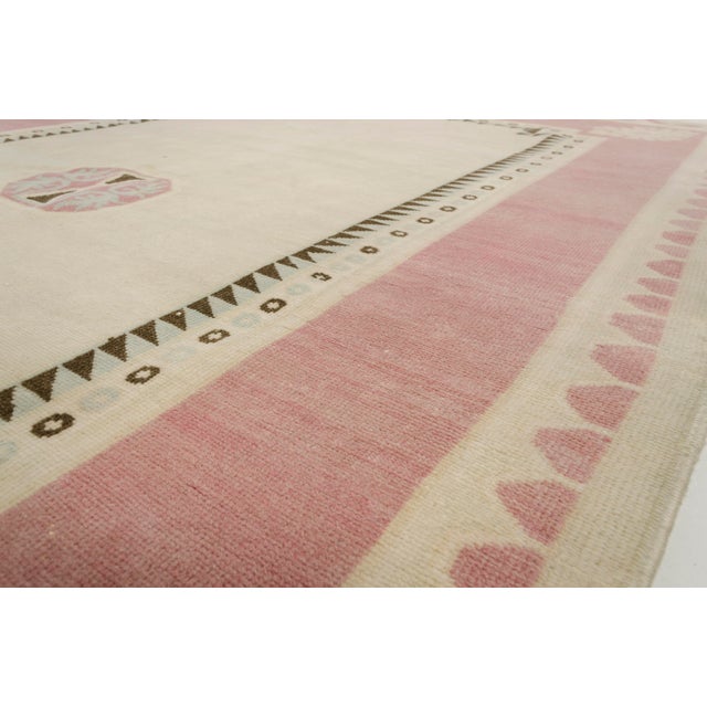 Bring a sense of calm and classic elegance to your home with this beautiful, handwoven vintage Turkish area rug. Featuring...