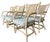 Set of six rattan swivel dining armchairs with cane backs and upholstered seats. Light neutral painted finish with...