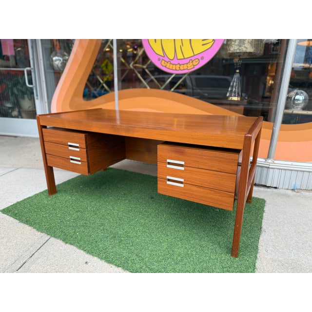 Danish Mid-Century Modern "Floating" Executive Desk in Teak by Dyrlund, Denmark, c. 1960s This iconic Danish modern...