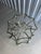 A Bernhardt centre table built from sweeping brass-finish bands that cross and arch into an eight-point star at both the...