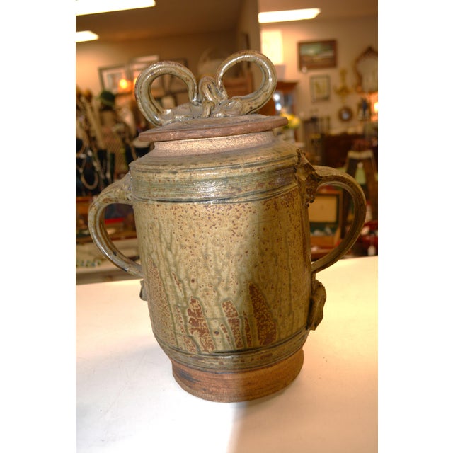 What an awesome art pottery cannister/container! Sadly it isn't signed. Very solid/sturdy. The width posted is across the...