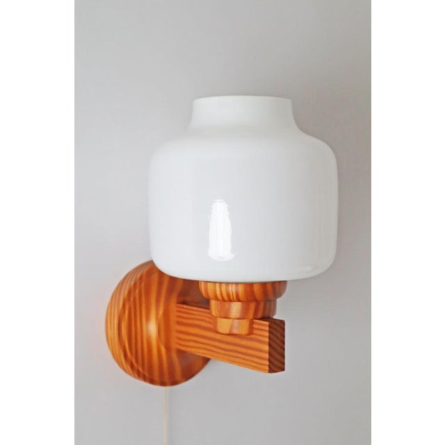 Scandinavian, classic, timeless a wall lamp with a beautiful aging of the wood, which makes the wall lamp unique. This...