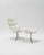 The "Corona" armchair with matching footstool, originally designed by Poul M. Volther and produced by Erik Jørgensen, is a...