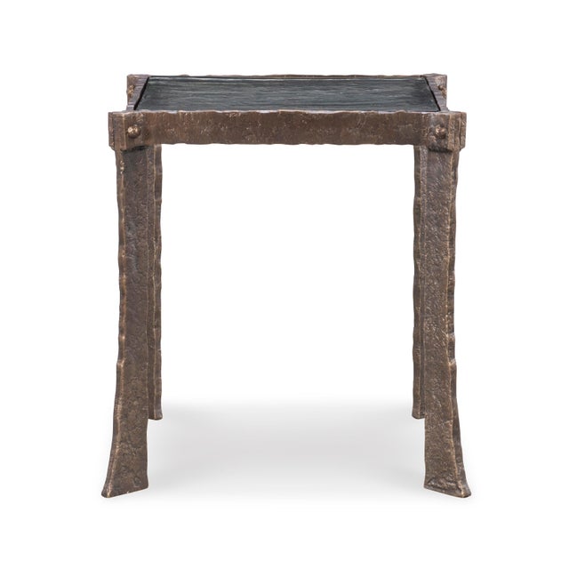 The textured iron frame provides a raw, organic feel, while the cast glass top adds a touch of refined elegance. This...