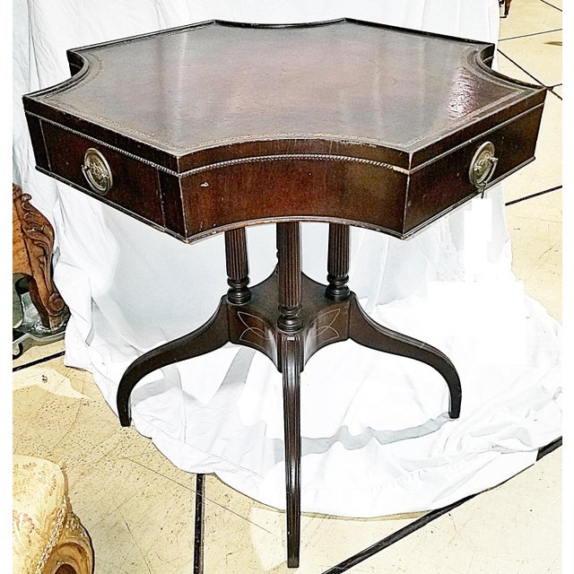 Unique shaped Duncan Phyfe style American made 1930-40s mahogany on oak frame side or end table with tooled leather tops...
