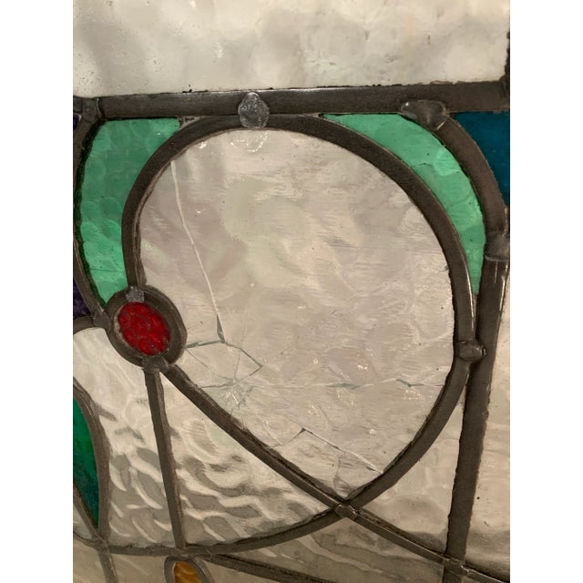 Vintage art stained glass featuring roses and hearts. Dimensions: w55" x d3" x h 24.5" Condition: age appropriate wear,...