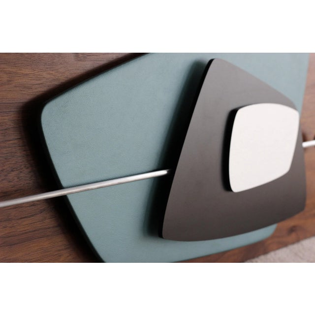 "RACER" Handmade Wood Wall Art This wall sculpture is enhanced with Turquoise metallic vinyl, black laminate, brushed...