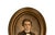 A charming, antique portrait print. Features a young boy in a black suit with wavy hair and dark brown eyes. Housed in an...