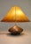 A sculpturally dynamic and profound large Arts & Crafts highly decorative Copper/Brass table lamp attributed to Olive...